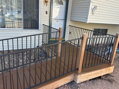 Close view of metal railing and posts on a newly built entry ramp